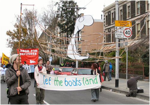 Leunig boat and banner - Let the boats land