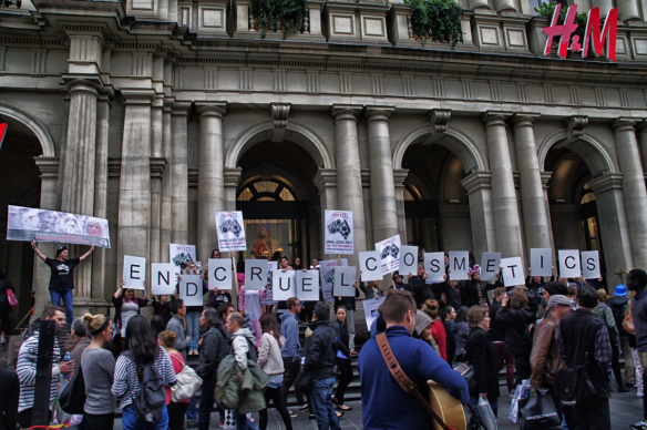 Protesters hold placards forming words 'End Cruel Cosmetics' on steps of old GPO