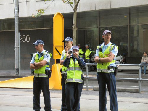 Team of police with video camera