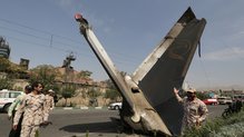 An aircraft tailfin bearing Sepahan's dolphin logo could be seen sticking out of the road