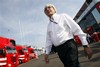 F1 boss Bernie Ecclestone walks the paddock prior to the start of the Italian Formula One Grand Prix, at the Monza racetrack, Sunday, Sept. 13, 2009.