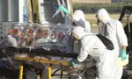 FILE - In this Aug. 7, 2014 file photo provided by the Spanish Defense Ministry, aid workers and doctors transfer Miguel Pajares, a Spanish priest who was infected with the Ebola virus while working in Liberia, from a plane to an ambulance as he leaves the Torrejon de Ardoz military airbase, near Madrid, Spain. A spokeswoman for a Madrid hospital says a Spanish missionary priest who was evacuated from Liberia last week after testing positive for Ebola has died, Tuesday Aug. 12, 2014 in the Carlos III hospital where he was being treated.