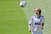 New Real Madrid player Luka Modric from Croatia plays with the ball before a press conference during his official presentation at the Bernabeu stadium in Madrid on Monday, Aug. 27, 2012.