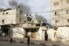 Smoke rises after an Israeli air strike in Rafah in the southern Gaza Strip on November 21, 2012. The Israeli military said it attacked about 100 targets in the coastal enclave of the Gaza Strip, during the night, using aircraft, warships and artillery.Photo by Ahmed Deeb / WN