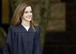 Actress Emma Watson walks between buildings following commencement services on the campus of Brown University, Sunday, May 25, 2014, in Providence, R.I. The actress, best known for her role as Hermione Granger in the “Harry Potter” movies, graduated with a bachelor's degree in English literature from the Ivy League university.