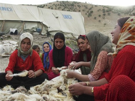 Kurdish women displaced by the conflict between Turkey and Kurdish rebels are seen at a refugee camp in the Qandil region, northern Iraq, Friday, May 2, 2008. Turkish warplanes bombed a key Kurdish rebel base deep inside Iraq for three hours overnight, Turkey's military and a rebel spokesman said Friday. The warplanes hit Iraq's Qandil region as well as 10 other sites near the Iraq-Iran border in an operation that began Thursday night and stretched into early Friday, a spokesman for the PKK rebel group said