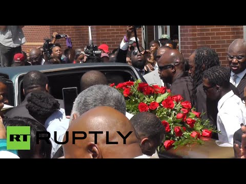 Thousands gather in Ferguson to mourn Michael Brown