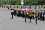 File - Russian President Vladimir Putin laying a wreath at the monument to the heroes of Severomorsk, 27 July, 2014.