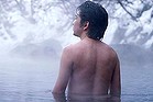 Man standing in hot spring.