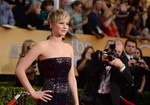 Jennifer Lawrence arrives at the 20th annual Screen Actors Guild Awards at the Shrine Auditorium on Saturday, Jan. 18, 2014, in Los Angeles.