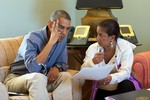 File - President Barack Obama talks with National Security Advisor Susan E. Rice following foreign leader phone calls, from Chilmark, Mass., August 11, 2014.