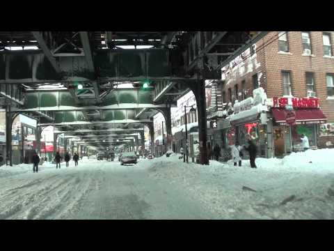 People Walking Along Roosevelt Avenue in Queens, New York  After Snow Storm