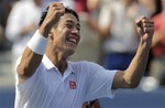 Kei Nishikori, of Japan, reacts after defeating Novak Djokovic