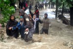 Locals rescuing  flood-affected villagers of Mirbazar in Kulgam  District South kashmir  After heavy rains deluged the Village Wednesday  on 03, September 2014.