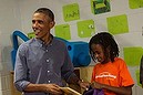 US President Barack Obama takes part in a service project to commemorate the September 11th National Day of Service and Remembrance at the Inspired Teaching School in Washington on September 11, 2014.  .AFP PHOTO/Nicholas KAMM