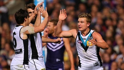 Angus Monfries and Ollie Wines of the Power celebrate a goal.