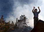 New York, N.Y. (Sept. 15, 2001) -- A New York City fireman calls for 10 more rescue workers to make their way into the rubble of the World Trade Center. cg1