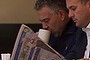 Treasurer Joe Hockey reads the budget coverage in the newspapers with Assistant minister for Infrastructure Jamie Briggs at a Canberra bakery on Wednesday 14 May 2014. Photo: Andrew Meares