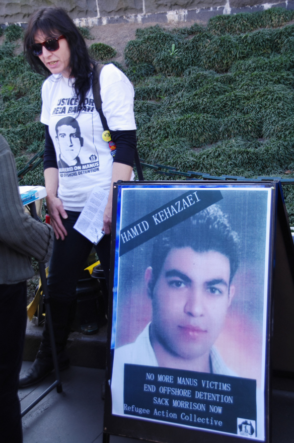 Placard showing photo of Hamid Kehasaei, who died that morning