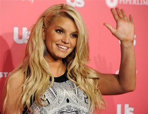 FILE - In this April 26, 2011 file photo, Jessica Simpson, recipient of the "Style Icon of the Year" honor, poses at Us Weekly's Annual Hot Hollywood Style Issue event, in Los Angeles. This time, it will be a boy for Jessica Simpson and fiance Eric Johnson. Simpson revealed on “Jimmy Kimmel Live!” Wednesday, March 6, 2013, that she is expecting a baby boy. She and Johnson are already parents of a daughter, Maxwell, born in May 2012.