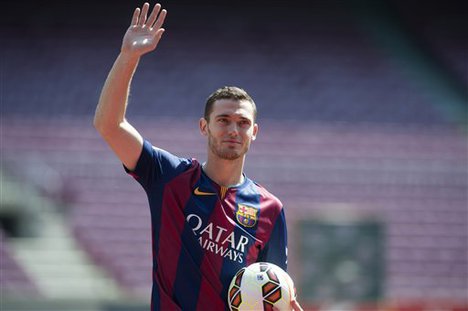 FC Barcelona's new Belgian Thomas Vermaelen gestures during his official presentation at the Camp Nou stadium in Barcelona, Spain, Sunday, Aug. 10, 2014. Vermaelen agreed to sign a five-year contract. The 28-year-old Vermaelen will now be under the orders of Barcelona's new coach Luis Enrique.