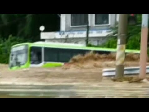 South Korea flash floods wash bus away