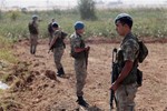 Turkish commandos stand near the Turkey-Syria border in Turkey, 