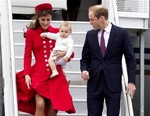 Britain's Prince William and Catherine, Duchess of Cambridge with Prince George arrive for their visit to New Zealand at the International Airport, in Wellington, New Zealand, Monday, April 7, 2014.