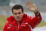 Marussia driver Jules Bianchi of France waves during drivers' parade before the Japanese Formula One Grand Prix at the Suzuka Circuit in Suzuka, central Japan, Sunday, Oct. 5, 2014.