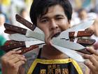 A vegetarian festival devotee parades through the streets in Phuket