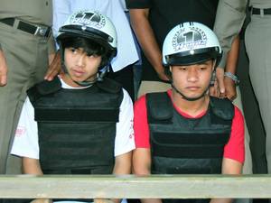 Two Myanmar migrant workers Win (left) and Saw (right) are suspects in the killing of two British tourists