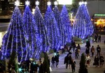 People walk by illuminated trees in Tokyo Tuesday, Nov. 4, 2008