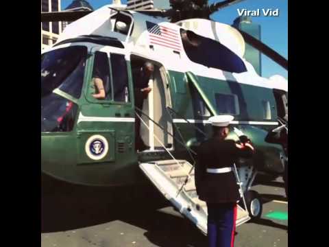 President Obama says hello to two Marines with the Latte Salute