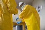 A licensed clinician sanitizes his hands after a simulated training session on Monday, Oct. 6, 2014, in Anniston, Ala. The Centers for Disease Control and Prevention (CDC) has developed an introductory training course for licensed clinicians.