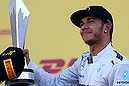 SOCHI, RUSSIA - OCTOBER 12:  Lewis Hamilton of Great Britain and Mercedes GP celebrates on the podium after victory in the Russian Formula One Grand Prix at Sochi Autodrom on October 12, 2014 in Sochi, Russia.  (Photo by Mark Thompson/Getty Images)