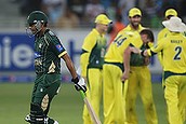 Australian players celebrate after the dismissal of Zulfiqar Babar, left, during the second one day international match between Australia and Pakistan in Dubai, United Arab Emirates, Friday, Oct. 10, 2014. (AP Photo/Kamran Jebreili)