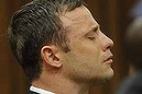 Oscar Pistorius reacts in the dock as Judge Thokozile Masipa delivers her verdict during his murder trial in Pretoria, South Africa, Thursday Sept. 11, 2014. Masipa ruled out a murder conviction for the double-amputee Olympian in the shooting death of his girlfriend, Reeva Steenkamp, but said he was negligent, raising the possibility he'll be convicted of culpable homicide. (AP Photo/Kim Ludbrook, Pool)