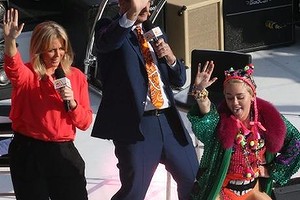 Miley Cyrus performs with Sunrise hosts Samantha Armytage and David Koch on Sunrise at the Sydney Opera House.