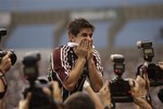 Fluminense's Conca celebrates after his team defeated Guarani 1-0 during the final match of the Brazilian soccer league in Rio de Janeiro, Brazil, Sunday, Dec. 5, 2010.