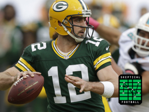 Green Bay Packers quarterback Aaron Rodgers looks to pass during the first half of an NFL football game against the Miami Dolphins, Sunday, Oct. 12, 2014, in Miami Gardens, Fla.