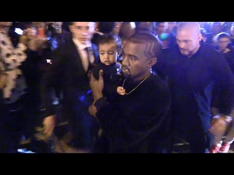 Kim Kardashian, Kanye West and Baby North leaving the Balanciaga Fashion Show in Paris