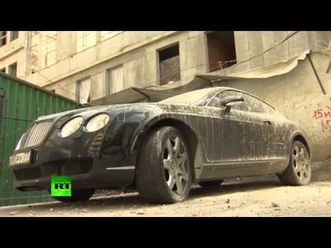 Only in Russia: Bentley supercar caked in concrete in Moscow