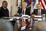 Army Gen. Lloyd Austin, Commander of the U.S. Central Command (CentCom), left, and Secretary of Defense Chuck Hagel, listen as President Barack Obama speaks during a meeting