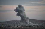 Thick smoke from an airstrike by the US-led coalition rises in Kobani