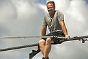 High wire walker Nik Wallenda talks with spectators as he balances on a 1,200 foot-long (366 meter) cable during a practice session in Sarasota, Florida, June 14, 2013.  