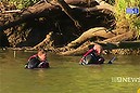 Police divers search for a man missing in the Brisbane river near Ipswich