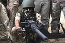 A Kurdish Peshmerga fighter undergoes training by British soldiers at a shooting range in Arbil, in Iraq's northern autonomous Kurdistan region, October 16, 2014.