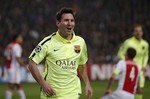 Barcelona's Lionel Messi celebrates scoring his side's 2nd goal during the Group F Champions League match between AFC Ajax and FC Barcelona at ArenA stadium in Amsterdam, Netherlands, Wednesday, Nov. 5, 2014.