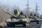 A pro-Russian rebel military vehicles convoy move towards Donetsk , Eastern Ukraine, Monday, Nov. 10, 2014.