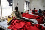 Indian women who underwent sterilization surgeries receive treatment at the District Hospital in Bilaspur, in the central Indian state of Chhattisgarh, Wednesday, Nov. 12, 2014, after at least a dozen died and many others fell ill following similar surgery.